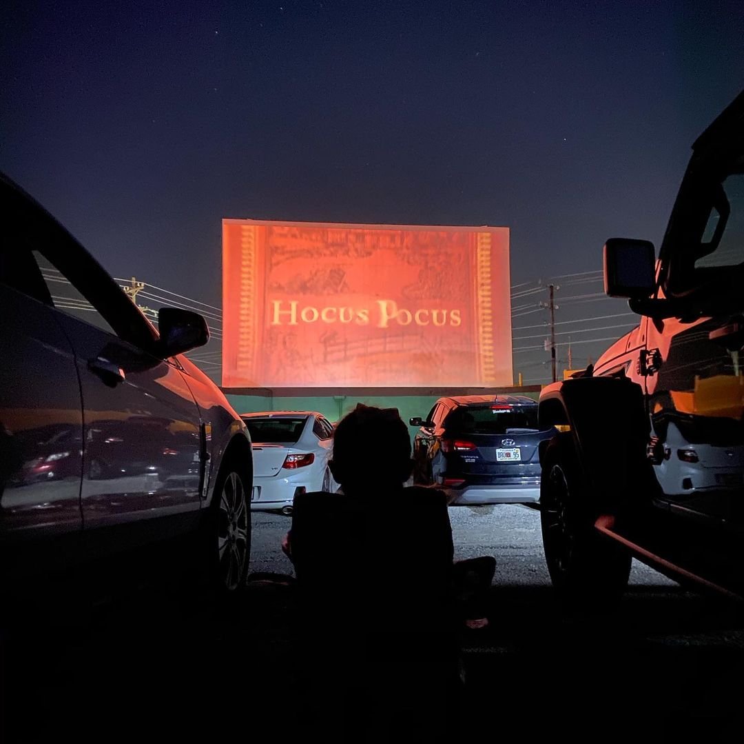 Drive-in movie theatre with hocus pocus on the screen