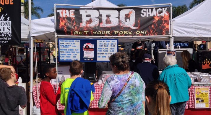 people standing in line for barbecue at Lakeland PigFest, one of many barbecue festivals in Central Florida